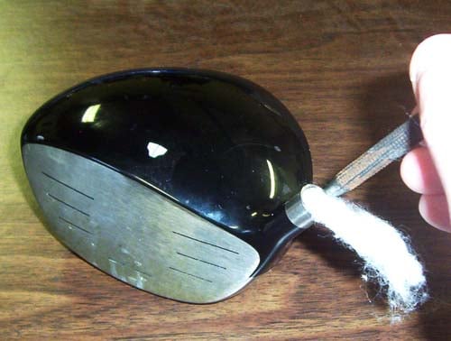 Cottoning a golf club with pin punch