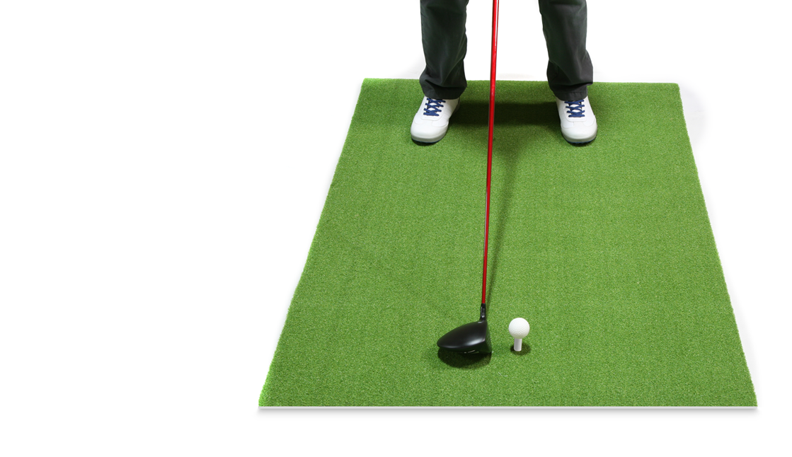 person standing on the Orlimar 3' x 5' Residential Golf Mat with a driver and a ball on the rubber golf tee