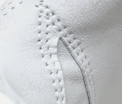 up-close view of double-stitching on an Intech Cabretta women’s glove