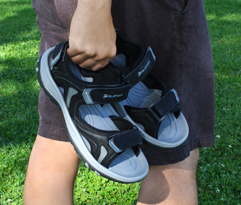 person carrying the fully adjustable Orlimar Men's Golf Sandals