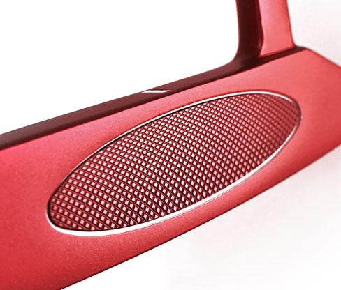Close up of the Bionik 101 Red putter's milled aluminum insert