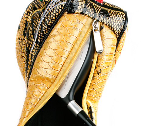 unzipped Yellow driver snake headcover over a driver head