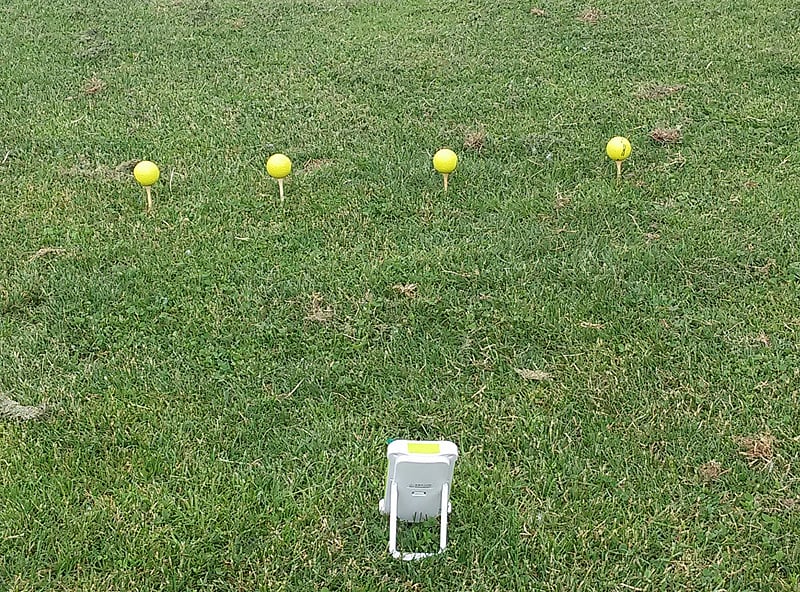 Golf ball at different tee heights