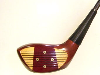 Wooden golf club head with face screws