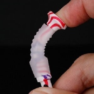 FlexTee Golf Tees are Flexible person bending a FlexTee golf tee with their fingers